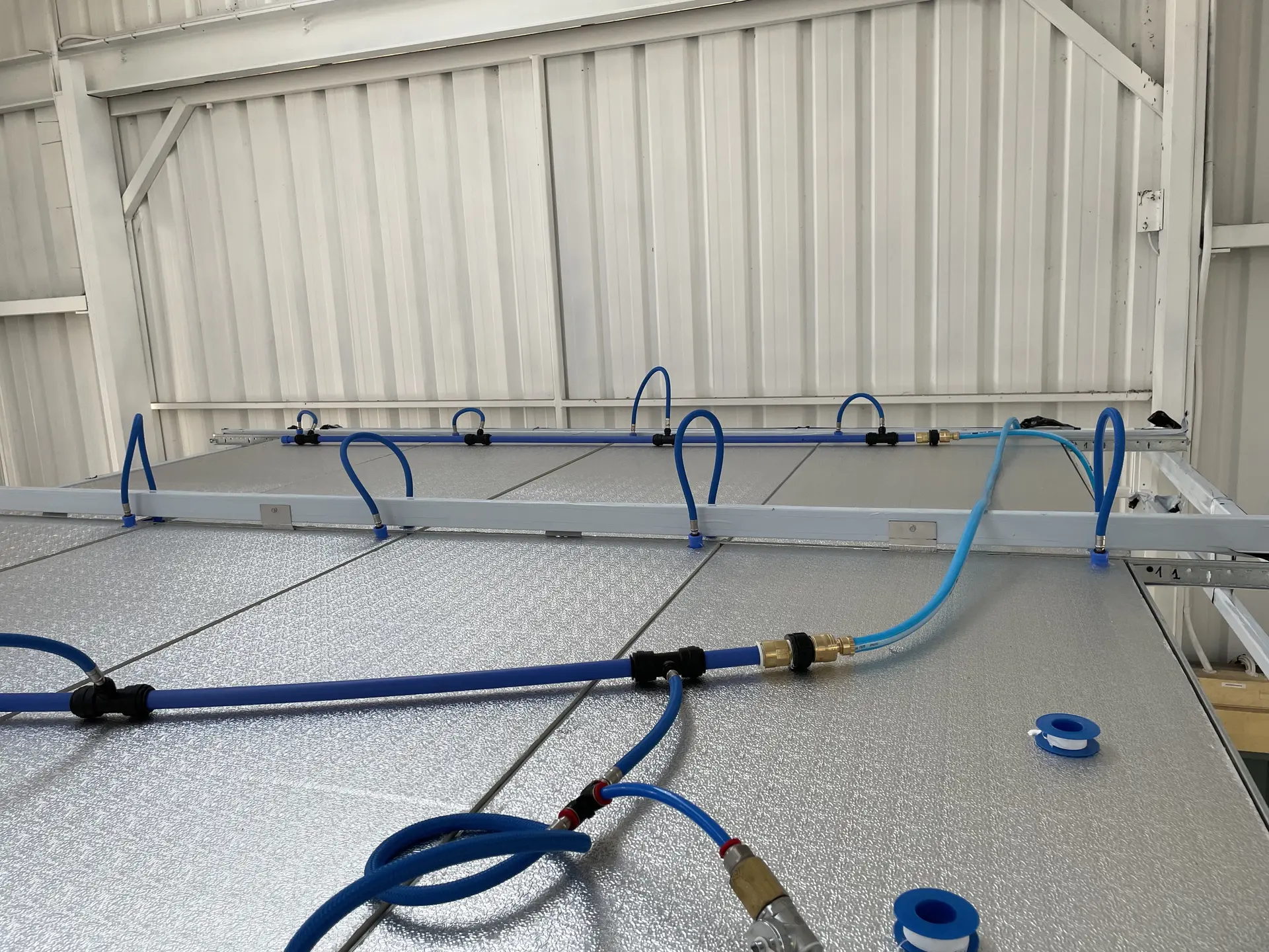 Multiple ceiling panels plumbed together for bench testing