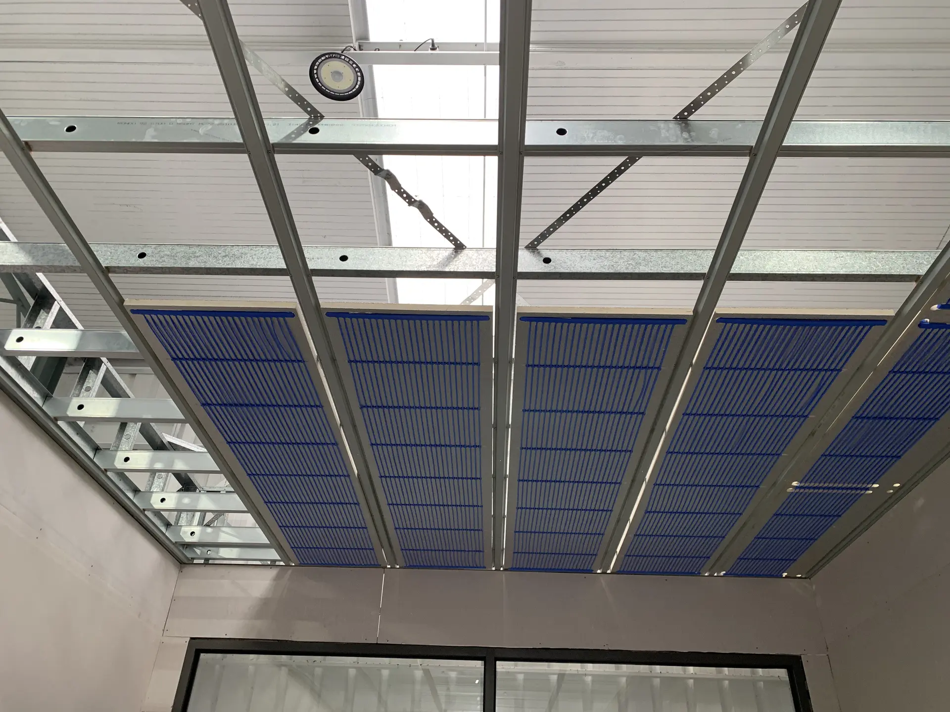 Hydronic ceiling panels installed in the suspended grid