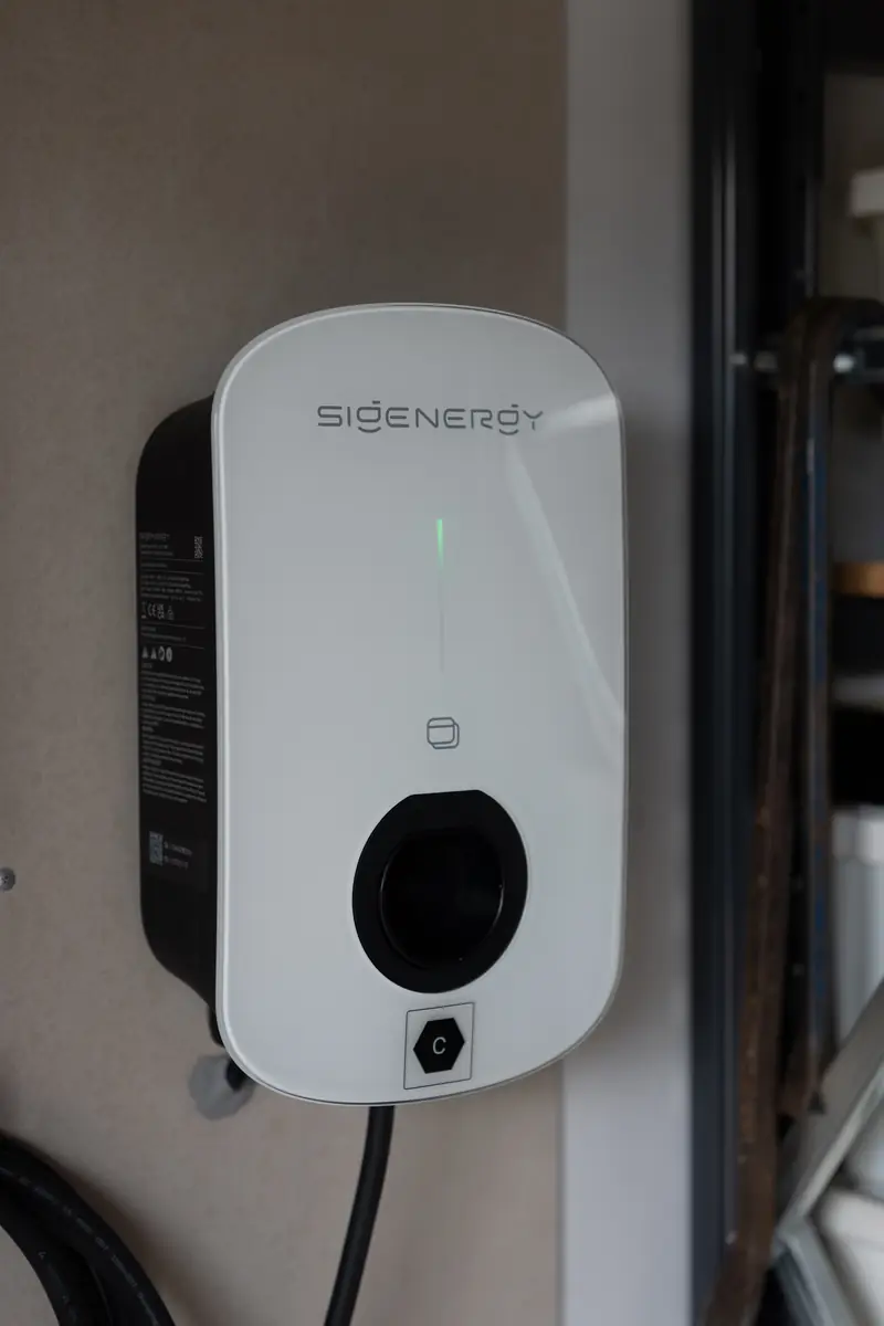 A Sigenergy Sigen EVAC charger installed on a garage wall by Environmental Energy Services